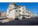 Exterior of townhomes with private garages and professionally landscaped grounds at 11250 Florence St # 28F, Commerce City, CO 80640