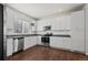 Well-equipped kitchen with stainless steel appliances, white cabinets, and plenty of counter space at 11250 Florence St # 28F, Commerce City, CO 80640