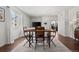 Open-concept living room with hardwood floors, dining area, and lots of natural light at 11250 Florence St # 28F, Commerce City, CO 80640