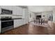 Modern kitchen with stainless steel appliances opens to the dining and living areas at 11250 Florence St # 28F, Commerce City, CO 80640