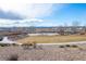 Overhead community tennis court with clear blue skies and minimal obstructions is an ideal outdoor play area at 11250 Florence St # 28F, Commerce City, CO 80640