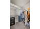Organized walk-in closet with shelving, drawers, and ample hanging space for storage at 11250 Florence St # 28F, Commerce City, CO 80640