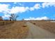 Path through natural scenery is an inviting space to walk or jog in the community at 11250 Florence St # 28F, Commerce City, CO 80640