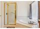 Well-maintained bathroom with walk-in shower and soaking tub providing the perfect spot to unwind after a long day at 8095 Bannock Dr, Larkspur, CO 80118