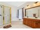 Bright bathroom with walk-in shower, soaking tub, double sinks, and stylish accents, creating a spa-like retreat at 8095 Bannock Dr, Larkspur, CO 80118