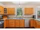 Well-designed kitchen featuring granite countertops, ample cabinet space, and a bright, inviting window at 8095 Bannock Dr, Larkspur, CO 80118