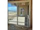 Sliding glass door providing access to deck with scenic views from new construction home at 901 Coal Bank Trl, Castle Rock, CO 80104