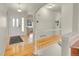 Bright entryway with hardwood floors, arched doorways, and a view of the staircase and living spaces at 9912 Bradbury St, Firestone, CO 80504