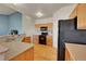 The kitchen features stainless steel appliances, light wood cabinets, and durable countertops, creating a modern space at 9912 Bradbury St, Firestone, CO 80504