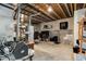 Unfinished basement space with exposed ceiling, concrete walls, and utilities at 10843 W Hinsdale Dr, Littleton, CO 80127