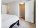 Bedroom featuring a view of closet with an open door and a bed with white comforter at 10843 W Hinsdale Dr, Littleton, CO 80127