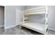 Bedroom featuring new bunk beds and a closet for storage at 10843 W Hinsdale Dr, Littleton, CO 80127