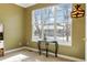 Bright bedroom with large windows and a decorative table at 10843 W Hinsdale Dr, Littleton, CO 80127