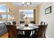 Dining room with chandelier and window view at 10843 W Hinsdale Dr, Littleton, CO 80127