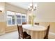 Cozy dining room with chandelier and white tablecloth at 10843 W Hinsdale Dr, Littleton, CO 80127