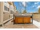 Relax in style with a beautiful wooden hot tub and metal fence and frame surrounding the tub at 10843 W Hinsdale Dr, Littleton, CO 80127