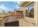 Charming patio featuring a convenient storage box and sliding glass doors at 10843 W Hinsdale Dr, Littleton, CO 80127