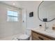 Beautiful bathroom featuring a glass-enclosed shower, modern vanity, and neutral color palette at 902 Poplar St, Denver, CO 80220