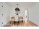 Inviting dining area features modern light fixture, comfortable seating, and stylish decor at 902 Poplar St, Denver, CO 80220