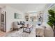 Well-lit living room showcasing custom built-ins, modern decor, and hardwood flooring at 902 Poplar St, Denver, CO 80220