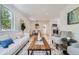 Bright living space offering a view of dining area and the kitchen, and featuring modern furnishings at 902 Poplar St, Denver, CO 80220