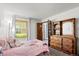 Bedroom features natural light and wooden furniture at 14271 E Dickinson Dr # F, Aurora, CO 80014