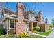 Charming townhome exterior with well-maintained landscaping and brick chimney detail at 14271 E Dickinson Dr # F, Aurora, CO 80014