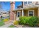 Inviting townhome exterior with vibrant landscaping and clear address display at 14271 E Dickinson Dr # F, Aurora, CO 80014