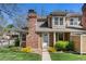 Charming townhome with brick chimney, landscaping, and welcoming entryway at 14271 E Dickinson Dr # F, Aurora, CO 80014