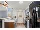 Bright kitchen featuring modern appliances, light cabinets, and an adjacent breakfast nook at 14271 E Dickinson Dr # F, Aurora, CO 80014