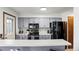 Well-equipped kitchen with gray cabinetry and black appliances, ready for cooking at 14271 E Dickinson Dr # F, Aurora, CO 80014
