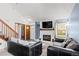 Inviting living room with fireplace and comfortable seating, bright and airy at 14271 E Dickinson Dr # F, Aurora, CO 80014