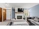 Comfortable living room with a white fireplace and sleek, modern furniture at 14271 E Dickinson Dr # F, Aurora, CO 80014