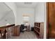 Cozy home office featuring a built-in desk, a window, and neutral carpet at 14271 E Dickinson Dr # F, Aurora, CO 80014
