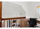 Home office overlooking living room featuring a built-in desk and neutral carpet at 14271 E Dickinson Dr # F, Aurora, CO 80014