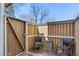Fenced in patio featuring wood decking and chairs at 14271 E Dickinson Dr # F, Aurora, CO 80014