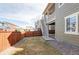 Fenced backyard showing access to the upper porch and lower patio at 19503 W 58Th Pl, Golden, CO 80403