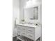 Elegant bathroom vanity with marble countertop, modern fixtures, and decorative mirror at 19503 W 58Th Pl, Golden, CO 80403