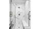 Modern bathroom featuring a frameless glass shower with marble-style tile and built-in bench at 19503 W 58Th Pl, Golden, CO 80403