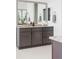 Bathroom features a gray vanity, granite countertop, a large mirror, and great lighting at 19503 W 58Th Pl, Golden, CO 80403