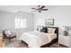 Inviting bedroom with neutral tones, a ceiling fan, and a cozy reading nook at 19503 W 58Th Pl, Golden, CO 80403