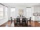 The dining area includes a wood table and multiple windows to bring in natural light at 19503 W 58Th Pl, Golden, CO 80403