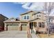 Charming two-story home features a three-car garage, a covered porch, and well-maintained landscaping at 19503 W 58Th Pl, Golden, CO 80403