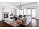 Cozy living room features a fireplace, hardwood floors, lots of natural light, and neutral decor at 19503 W 58Th Pl, Golden, CO 80403