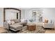 Cozy living room featuring stylish sectional, decorative rug, and built-in bookshelves for organized living at 19503 W 58Th Pl, Golden, CO 80403