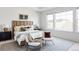 Comfortable main bedroom with a neutral color palette, lots of natural light, and carpeted floor at 19503 W 58Th Pl, Golden, CO 80403