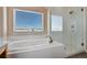 Spa-like bathroom with soaking tub and walk-in shower at 20190 Sedgemere Rd, Monument, CO 80132