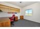 Bright home office with built-in shelving and a view at 20190 Sedgemere Rd, Monument, CO 80132