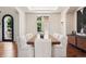 Formal dining room with a large wood table, seating for ten, and elegant decor at 9171 E Harvard Ave, Denver, CO 80231