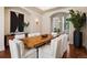 Formal dining room with a large wood table, seating for eight, and elegant decor at 9171 E Harvard Ave, Denver, CO 80231